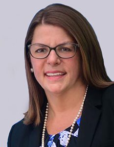 Headshot of a woman wearing glasses